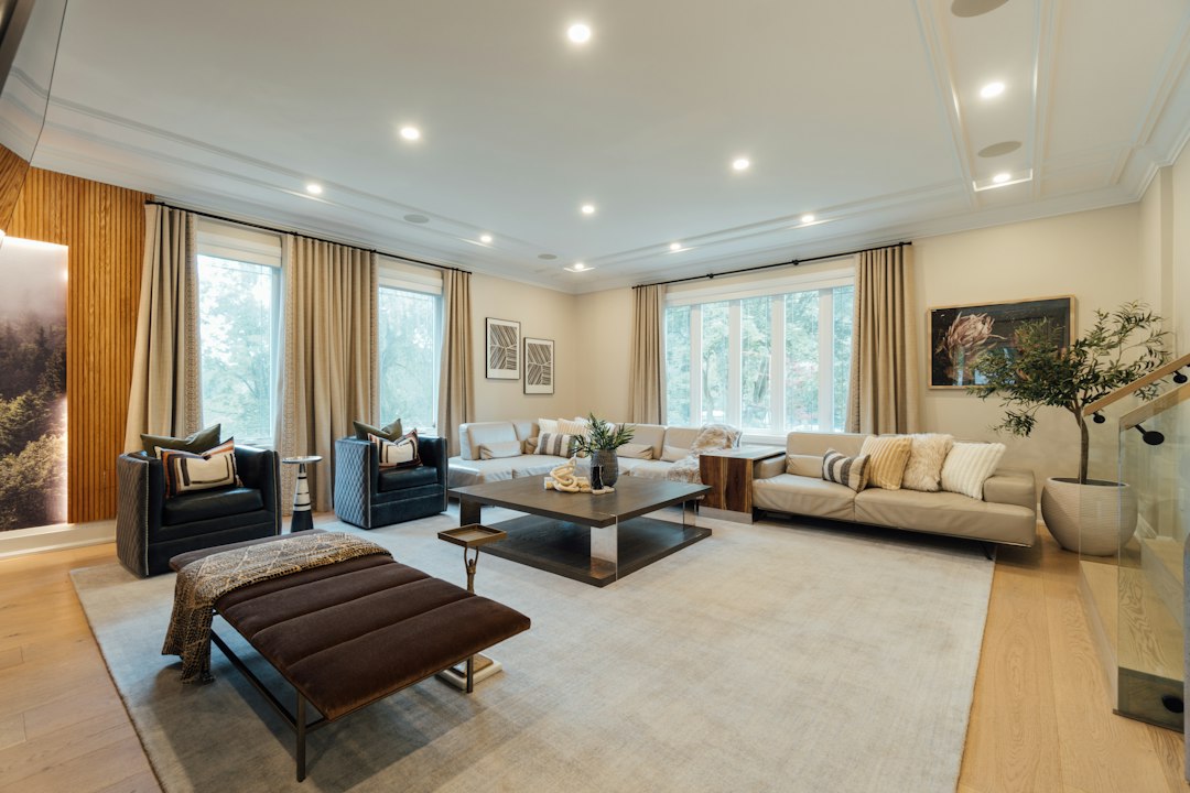 Contemporary living room with large windows and curtains