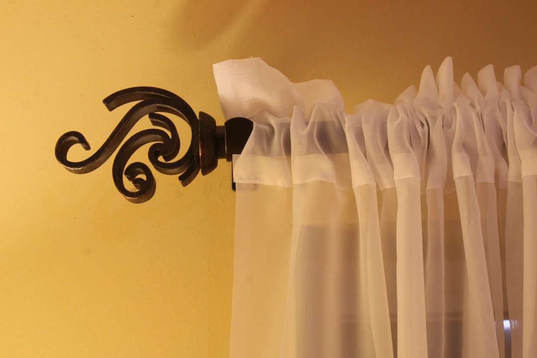 Decorative curtain rod above elegant curtains