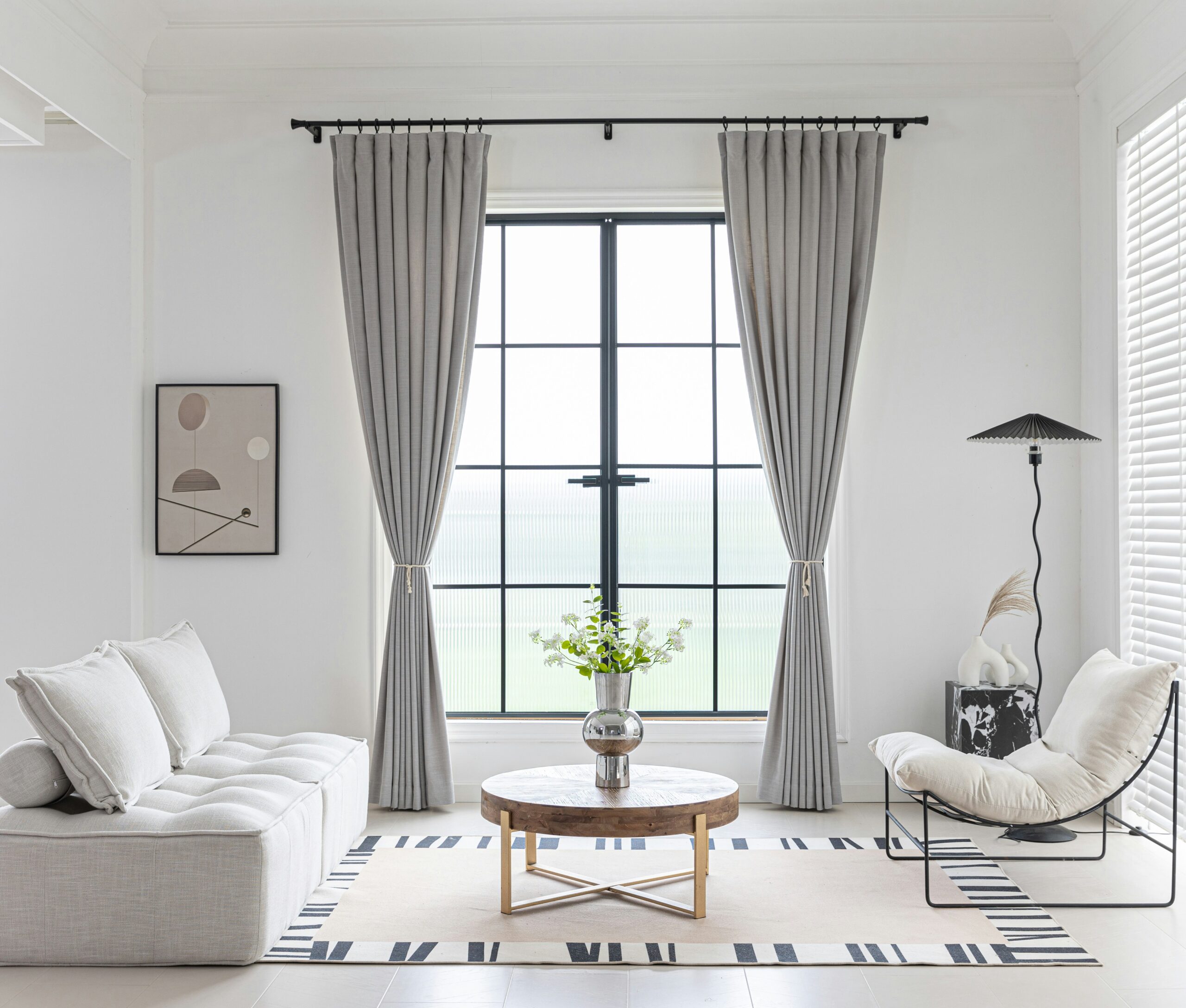 Dark metal honeycomb blind with decorative finial