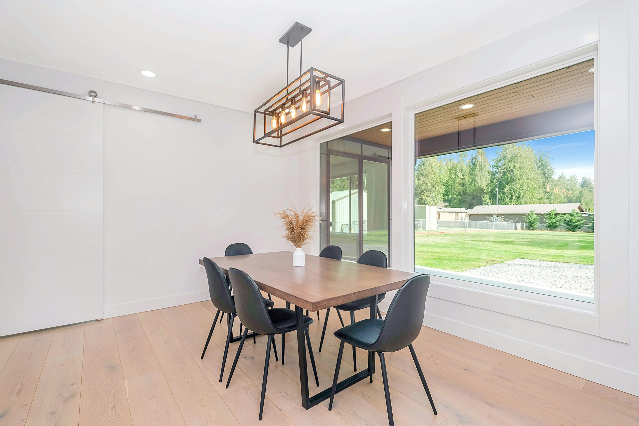Minimal curtain track and white window treatment