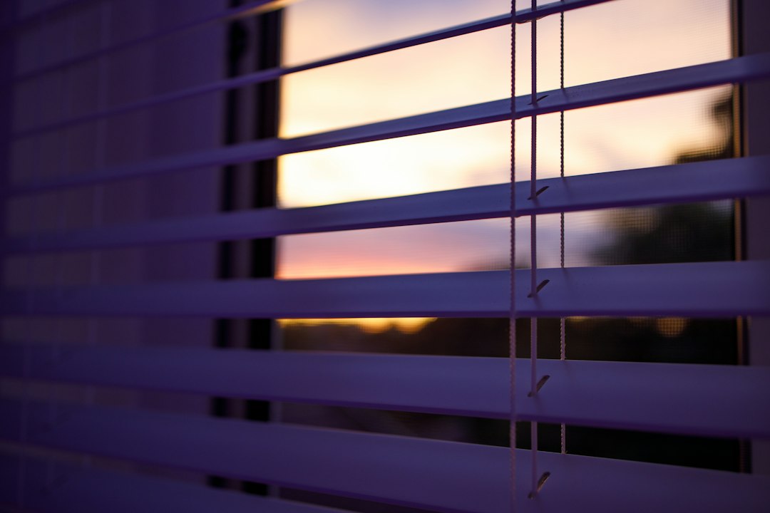 Venetian blinds with slats angled closed for privacy